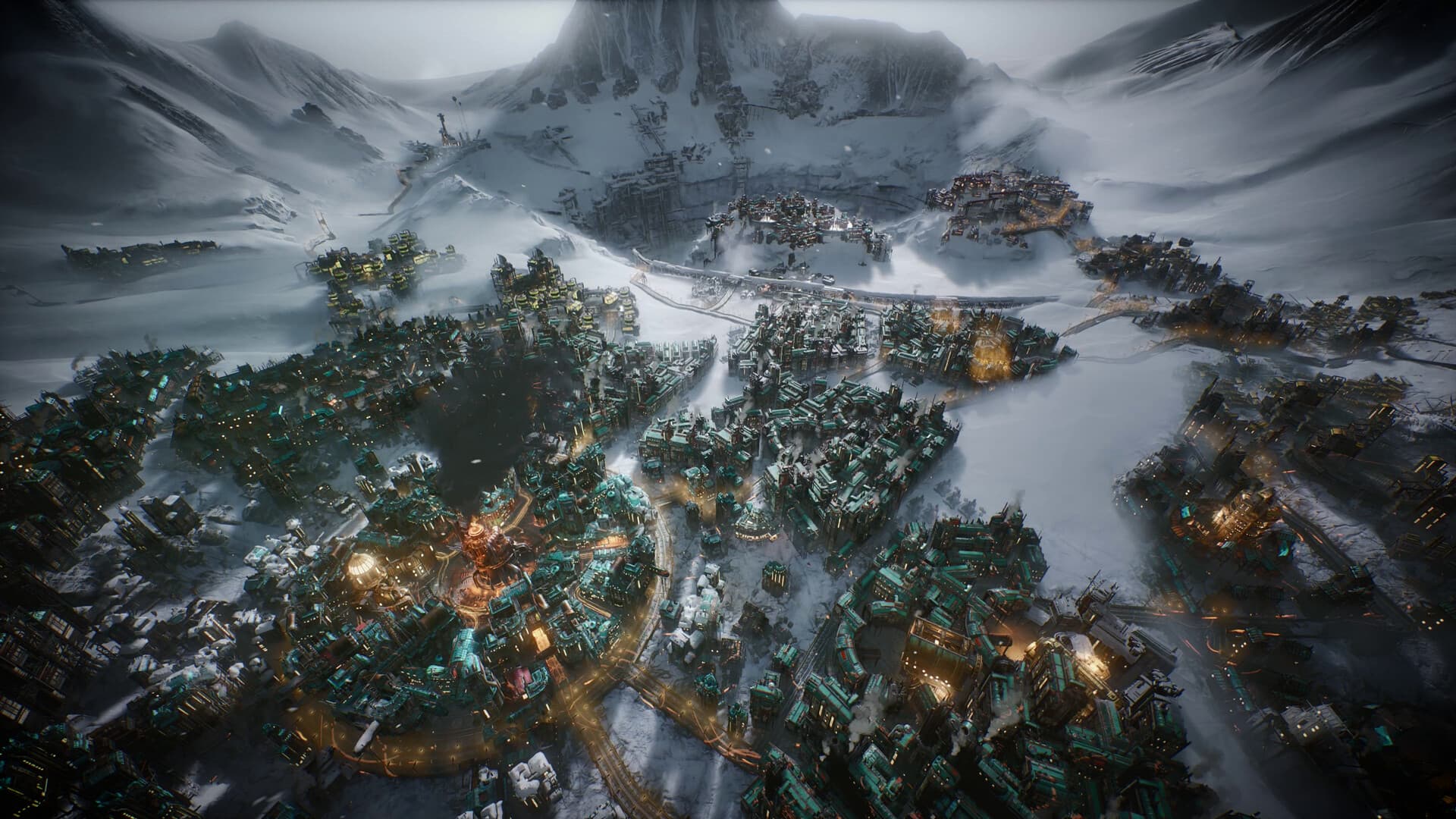 Frostpunk 2: Eine Luftansicht zeigt eine verschneite Stadt mit ihren Bezirken.