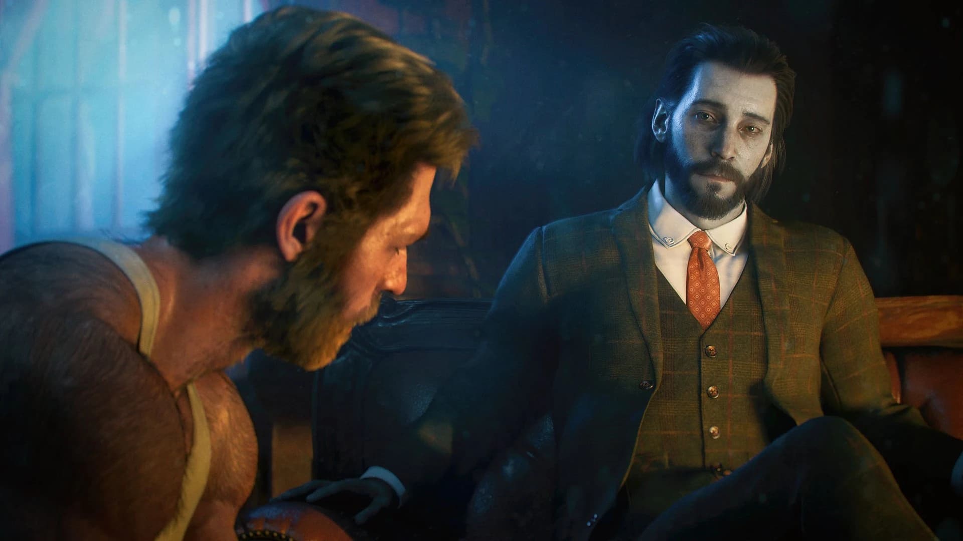 Marvel’s Wolverine — Logan parle avec Essex dans une pièce faiblement éclairée.