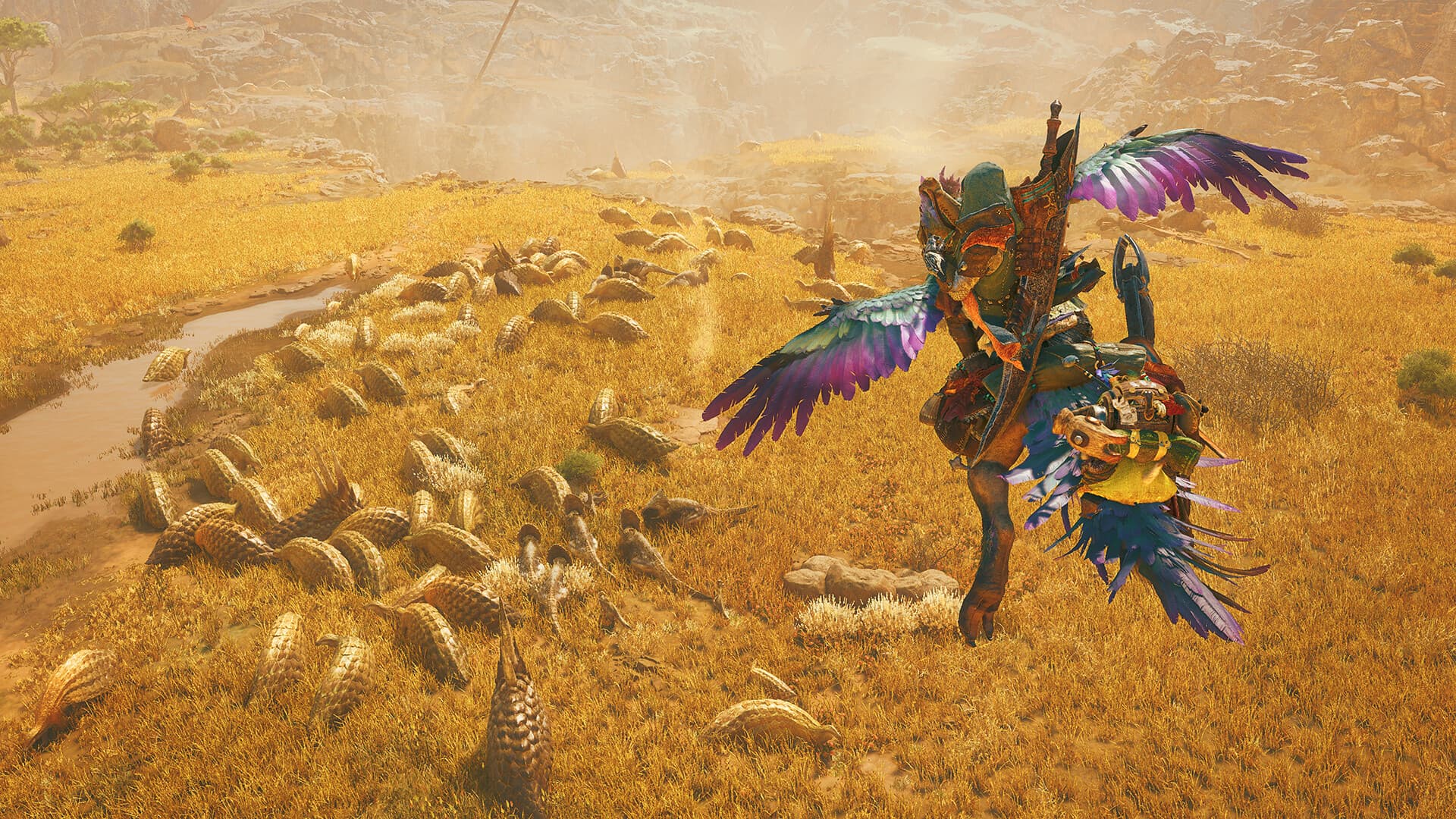 『Monster Hunter Wilds』のゲーム画面:砂漠でハンターが大型モンスターと対峙する場面。