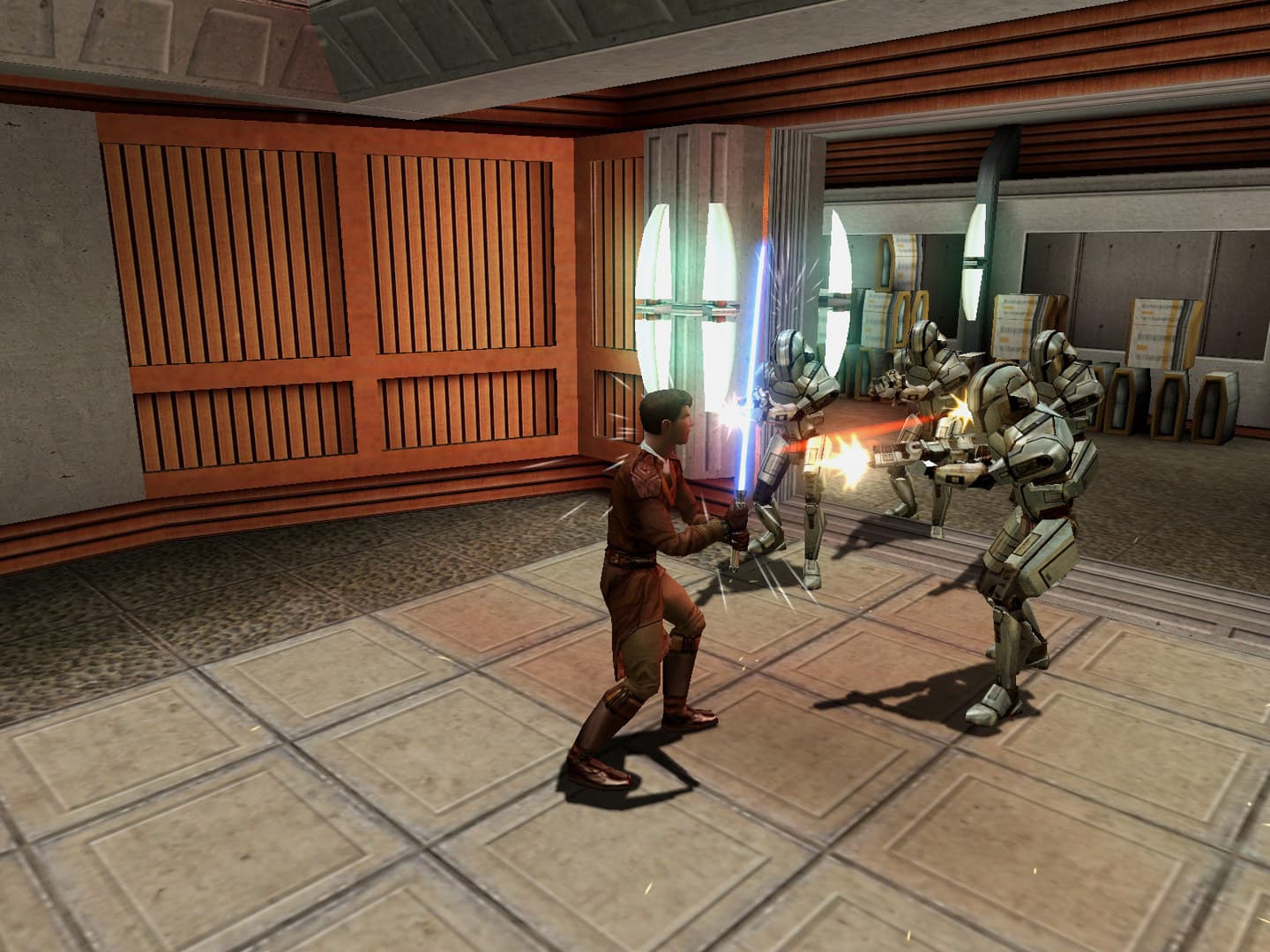 «STAR WARS™ Knights of the Old Republic™»: два персонажа сражаются в тренировочном зале.